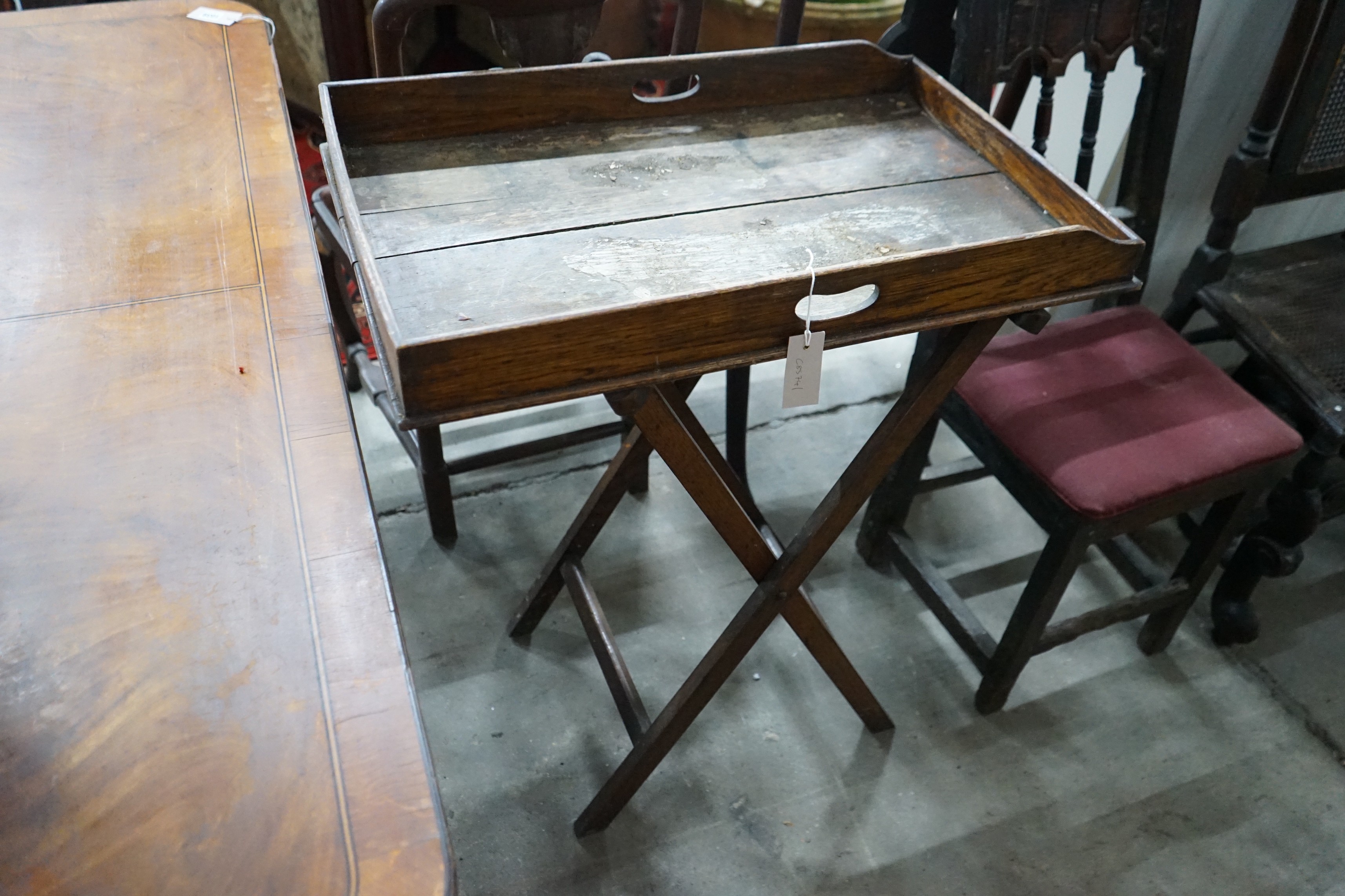 An early 18th century style oak joint stool, width 46cm, depth 30cm, height 38cm and a Victorian butler's tray on stand